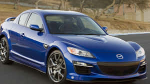 Sleek Mazda Rx-8 In Action Wallpaper