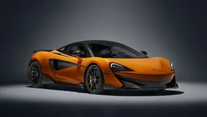 Sleek Mclaren 600lt Cruising On The Open Road Wallpaper