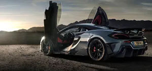 Sleek Mclaren 600lt Exhilarating Performance On The Open Road Wallpaper
