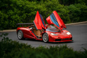 Sleek Mclaren F1 On The Road Wallpaper