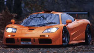 Sleek Mclaren F1 Sports Car On The Track Wallpaper