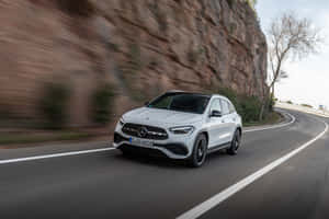 Sleek Mercedes Benz Gla-class In A Vibrant Cityscape Wallpaper