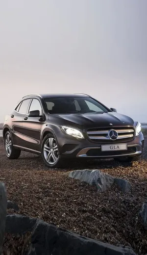 Sleek Mercedes Benz Gla-class In Vivid Nature Setting Wallpaper