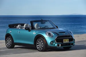 Sleek Mini Cooper Convertible Basking In The Sun Wallpaper