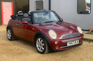 Sleek Mini Cooper Convertible Soaking Up The Sunshine Wallpaper