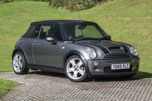 Sleek Mini Cooper S Convertible On The Open Road Wallpaper