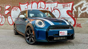 Sleek Mini Cooper S In Urban Landscape Wallpaper