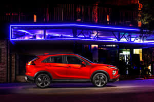 Sleek Mitsubishi Eclipse Cross Under The Vibrant Sky Wallpaper