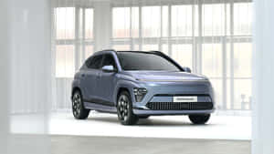 Sleek, Modern Electric Vehicle At Charging Station Wallpaper