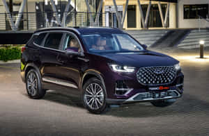 Sleek New Chery Tiggo 8 In Glamorous City Nightlights Wallpaper