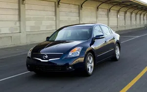 Sleek Nissan Altima In A Scenic Landscape Wallpaper