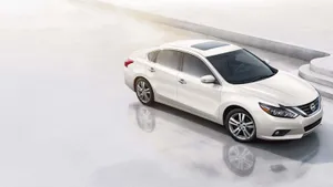 Sleek Nissan Altima In Motion Wallpaper