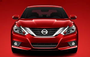 Sleek Nissan Altima In Nature Wallpaper