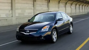 Sleek Nissan Altima In Stunning Surroundings Wallpaper