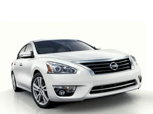 Sleek Nissan Altima On The Open Road Wallpaper