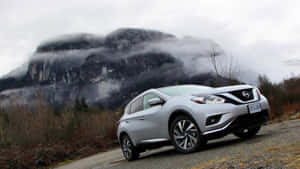 Sleek Nissan Murano Cruising Down A Beautiful Scenic Road Wallpaper