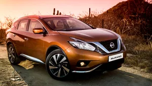 Sleek Nissan Murano On A Scenic Drive Wallpaper