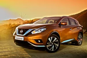 Sleek Nissan Murano On Scenic Highway Wallpaper