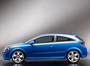 Sleek Opel Astra In A Dynamic Setting Wallpaper