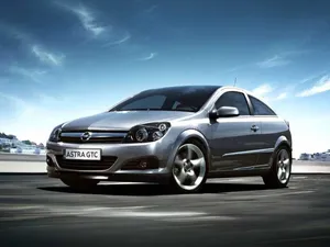 Sleek Opel Astra In Action On The Road Wallpaper