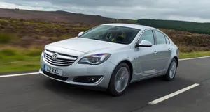 Sleek Opel Insignia Parked Outdoors Wallpaper