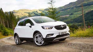 Sleek Opel Mokka Cruising On The Open Road Wallpaper