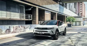 Sleek Opel Mokka On Scenic Road Wallpaper