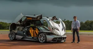 Sleek Pagani Huayra Luxury Sports Car In Action Wallpaper