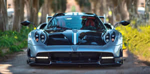 Sleek Pagani Huayra Roadster Bc Cruising On The Open Road Wallpaper