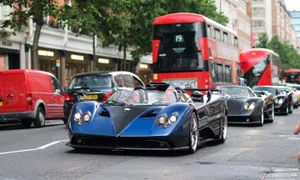 Sleek Pagani Zonda Hp Barchetta Cruising On The Road Wallpaper