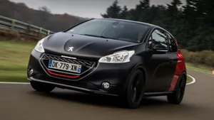 Sleek Peugeot 208 In Action Wallpaper