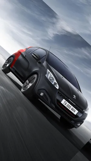 Sleek Peugeot 208 In Action Wallpaper