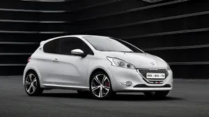 Sleek Peugeot 208 In Stunning Urban Environment Wallpaper