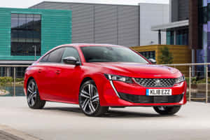 Sleek Peugeot 508 In Motion Wallpaper