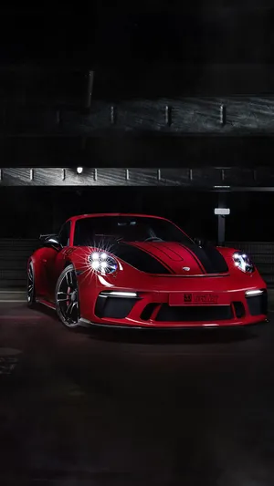 Sleek Porsche On An Open Road Wallpaper