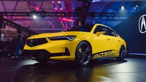 Sleek Red Acura Integra On The Road Wallpaper