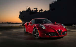 Sleek Red Alfa Romeo 4c On Open Road Wallpaper