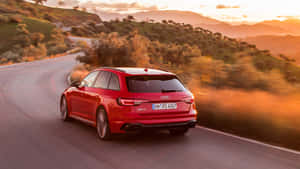 Sleek Red Audi Rs5 In Action Wallpaper