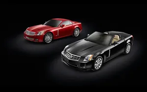 Sleek, Red Cadillac Xlr Turning Heads On The Open Road Wallpaper