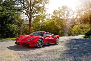 Sleek Red Ferrari 488 Spider On Display Wallpaper