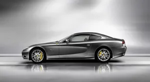 Sleek Red Ferrari 612 Scaglietti In A High-resolution Wallpaper Wallpaper