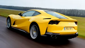 Sleek Red Ferrari 812 Superfast In Action Wallpaper