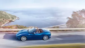 Sleek Red Ferrari California T Cruising The Streets Wallpaper