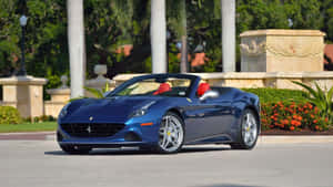 Sleek Red Ferrari California T On The Road Wallpaper