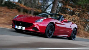 Sleek Red Ferrari California T Parked Outdoors Wallpaper