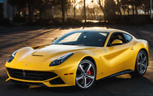 Sleek Red Ferrari F12 Berlinetta In Motion On Open Road Wallpaper