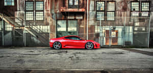 Sleek Red Ferrari F430 In Action Wallpaper