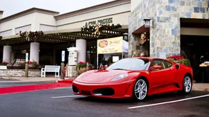 Sleek Red Ferrari F430 On The Road Wallpaper