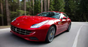 Sleek Red Ferrari Ff On The Open Road Wallpaper