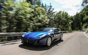 Sleek Red Ferrari Gtc4lusso In Action Wallpaper